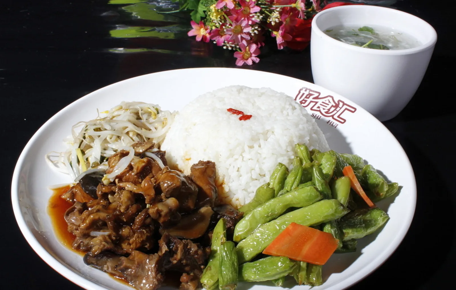 Chinese restaurant rice plate with meat and vegetables in North America