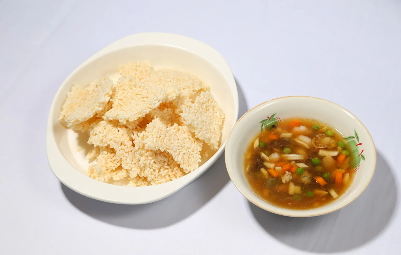 Crisp rice with seafood representing Chinese food exchange in Southeast Asia