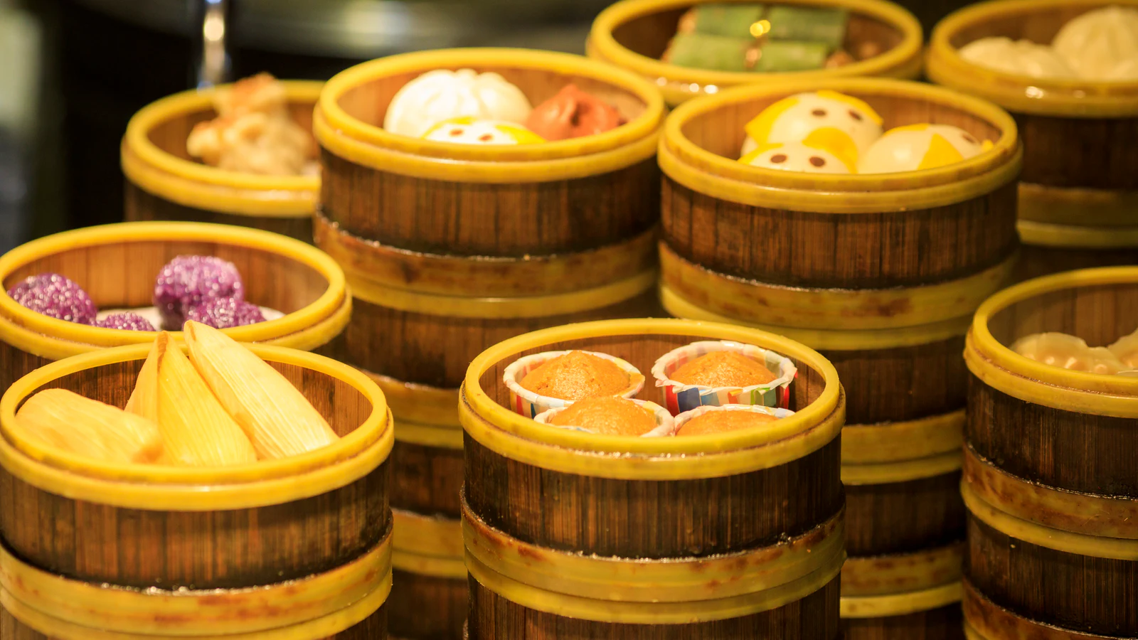 Bamboo baskets holding an assortment of colorful Chengdu snacks