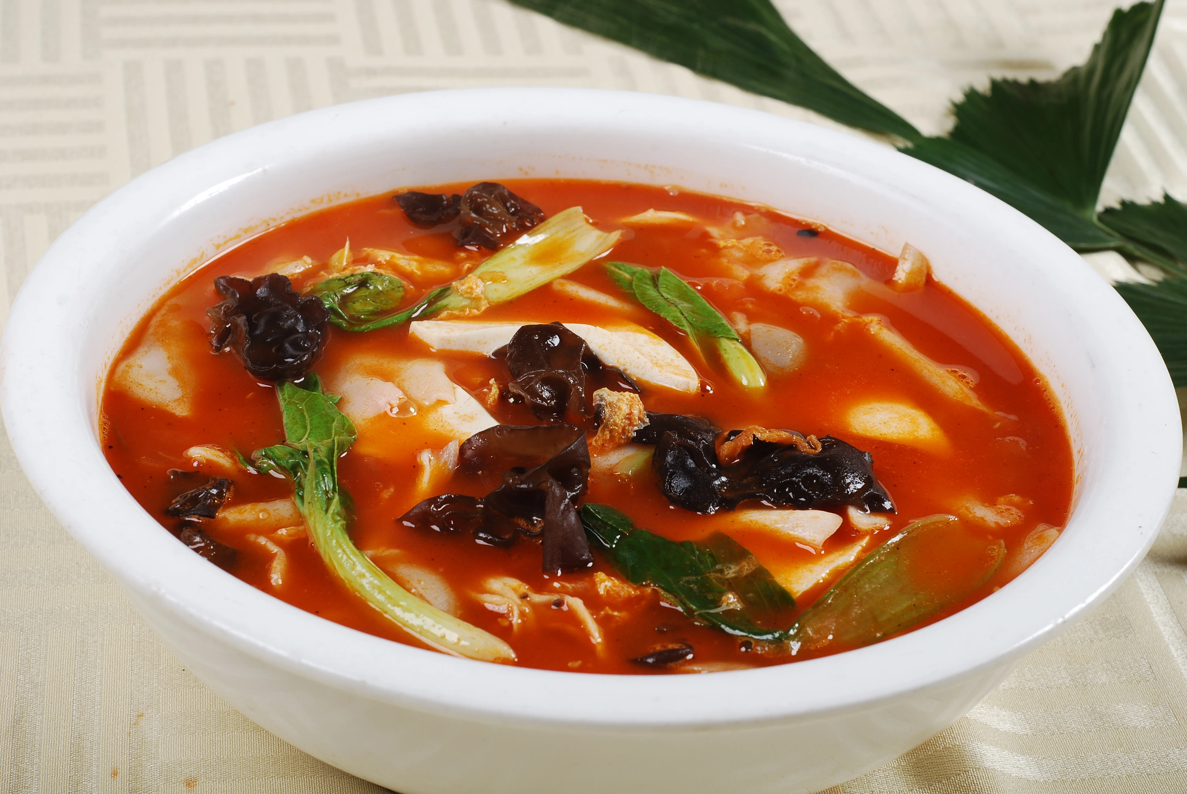 Henan-style broad huimian sheets arranged on a plate before cooking