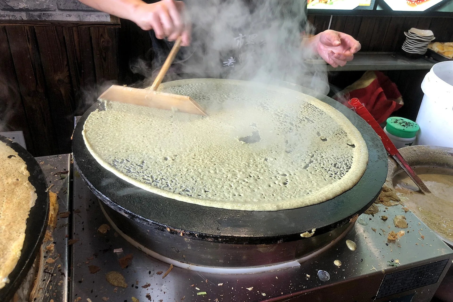 Jianbing prepared as a popular Chinese breakfast and street snack
