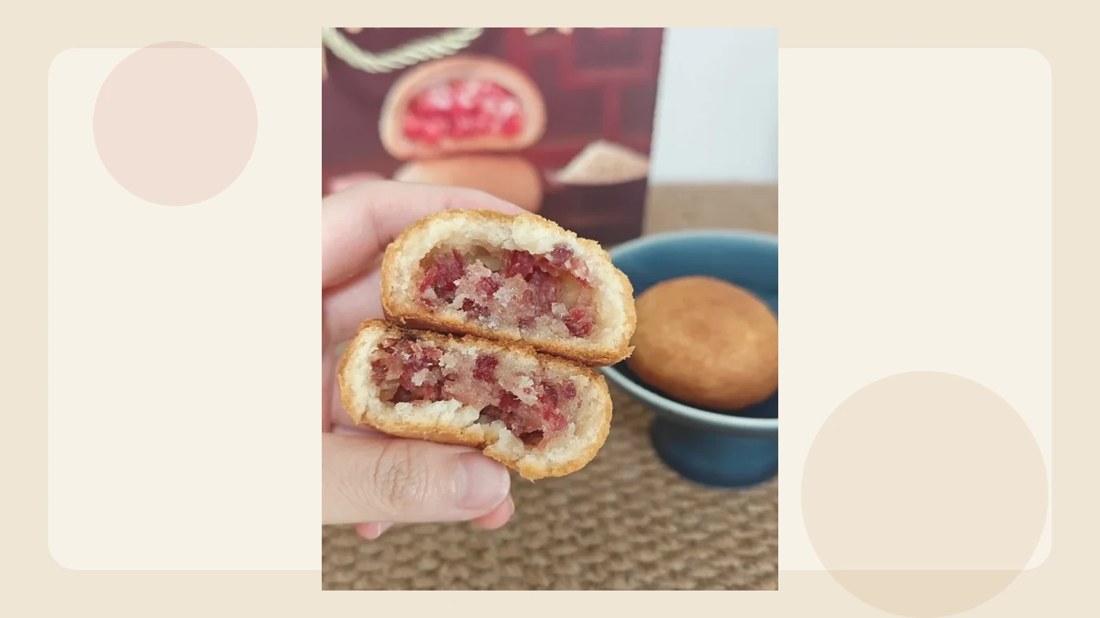 Mooncake with Yunnan ham filling held open to show its crumbly sweet-savory interior