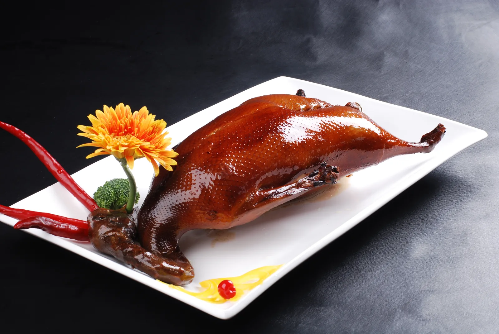 Whole Cantonese roast goose with glossy brown skin