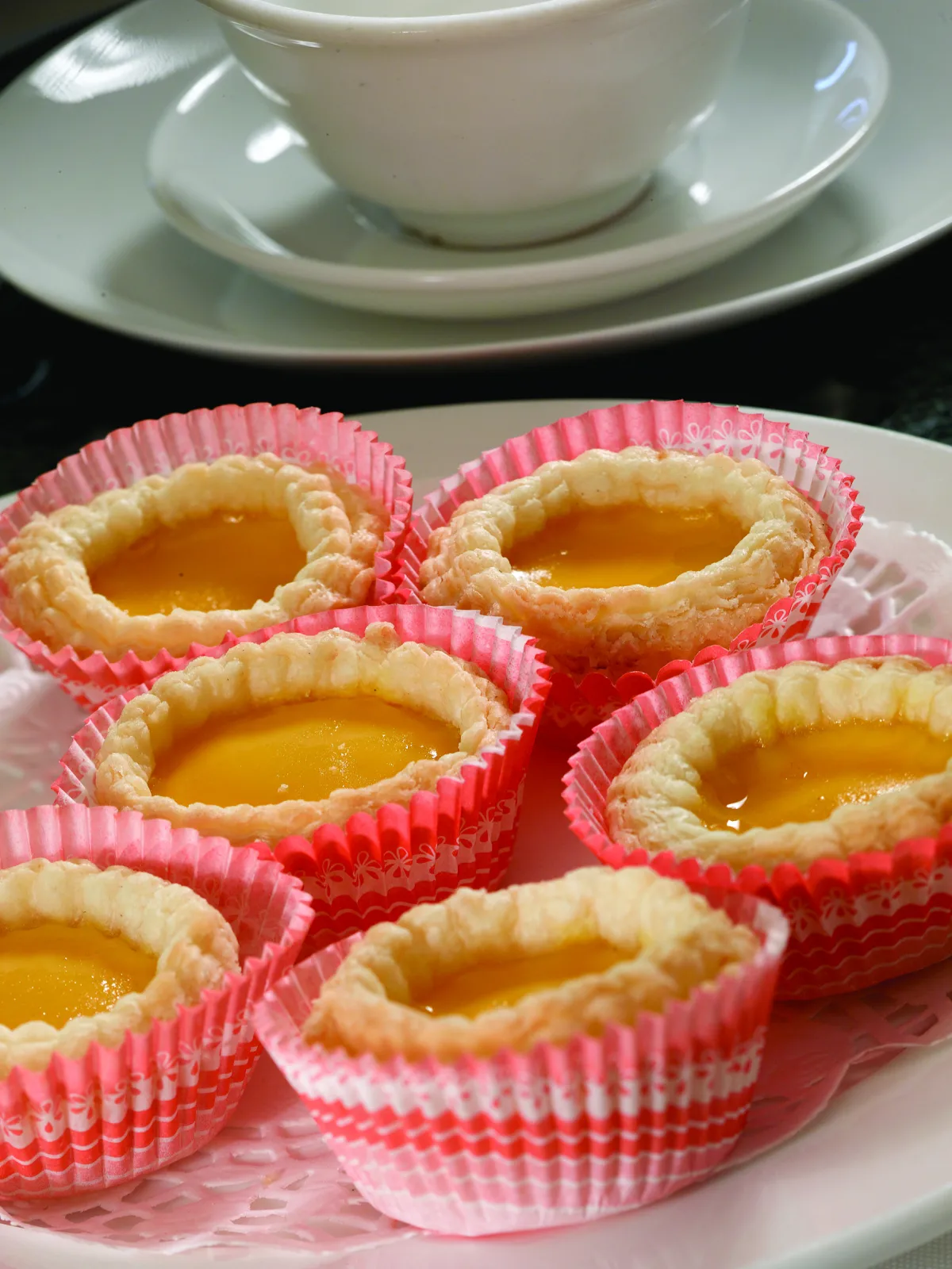 Cantonese egg tarts with flaky pastry and golden custard