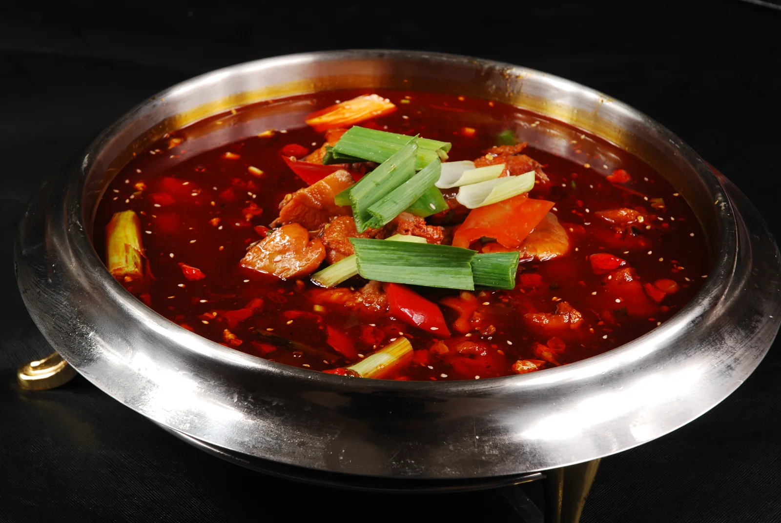 Spring-water chicken cooked in a red broth with chilies and scallions