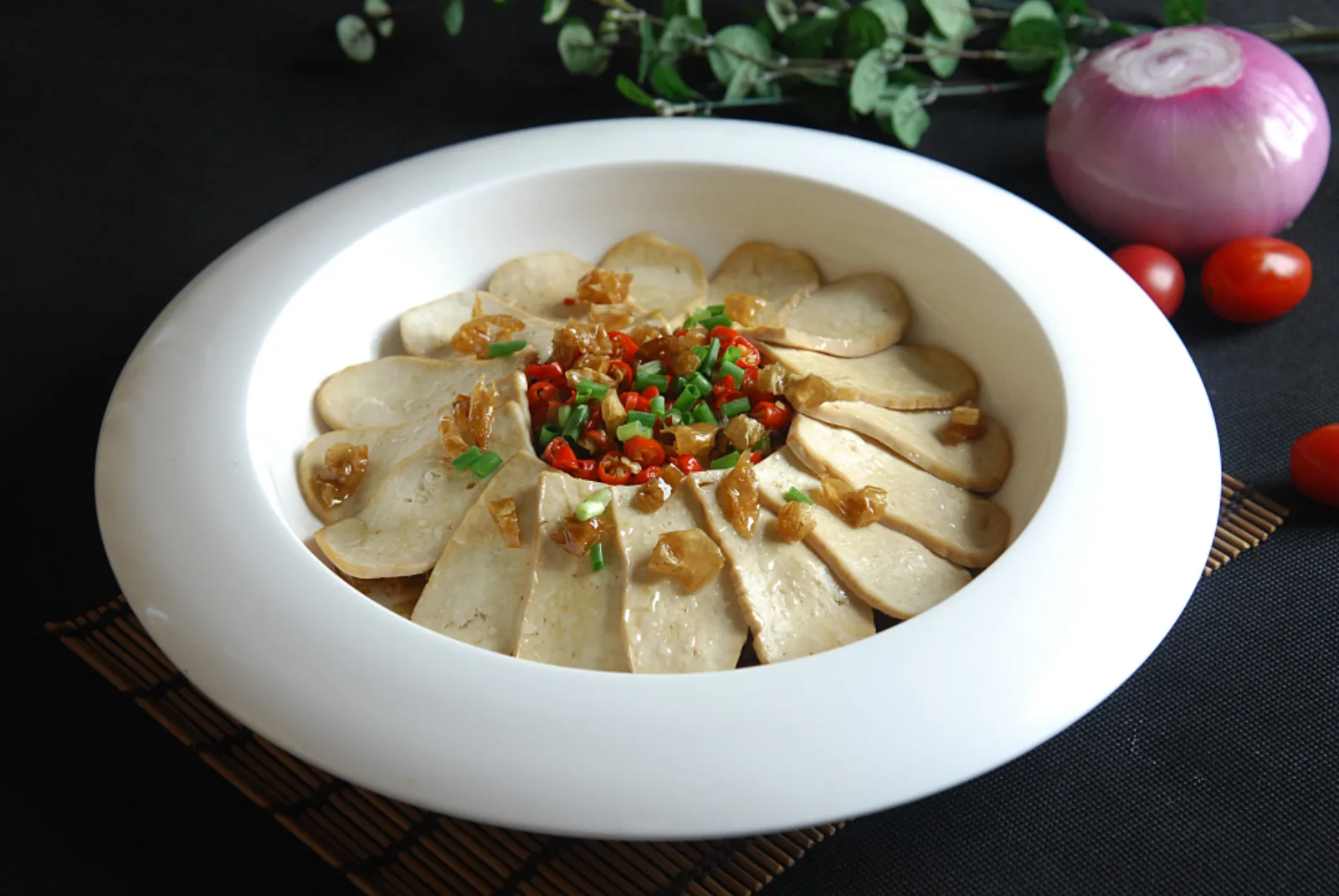 Hunan white chili steamed tofu arranged with preserved chilies and scallions