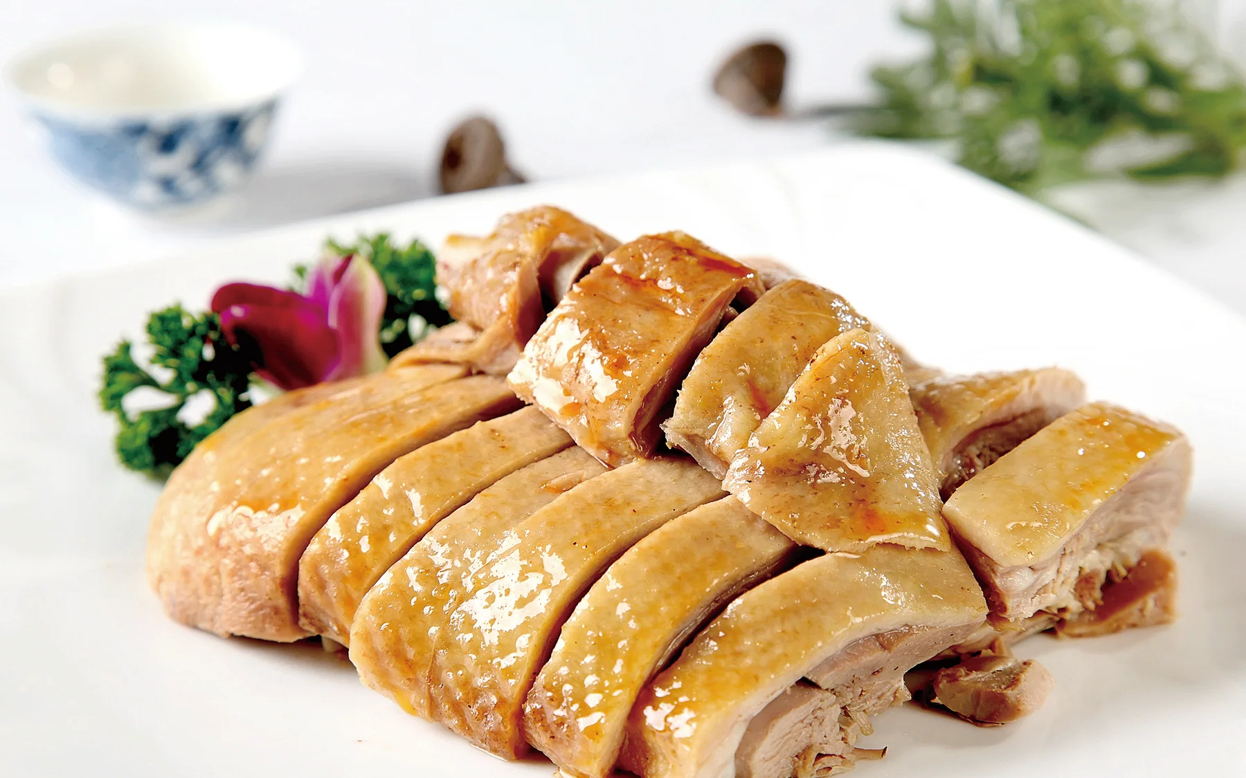 A whole Nanjing-style saltwater duck chopped across the bone, showing a provincial cold-dish format rather than a plated city-page duplicate