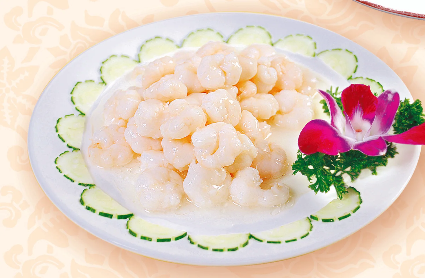 Pale river shrimp cooked to preserve their tender shape, making freshness and seconds of heat visible