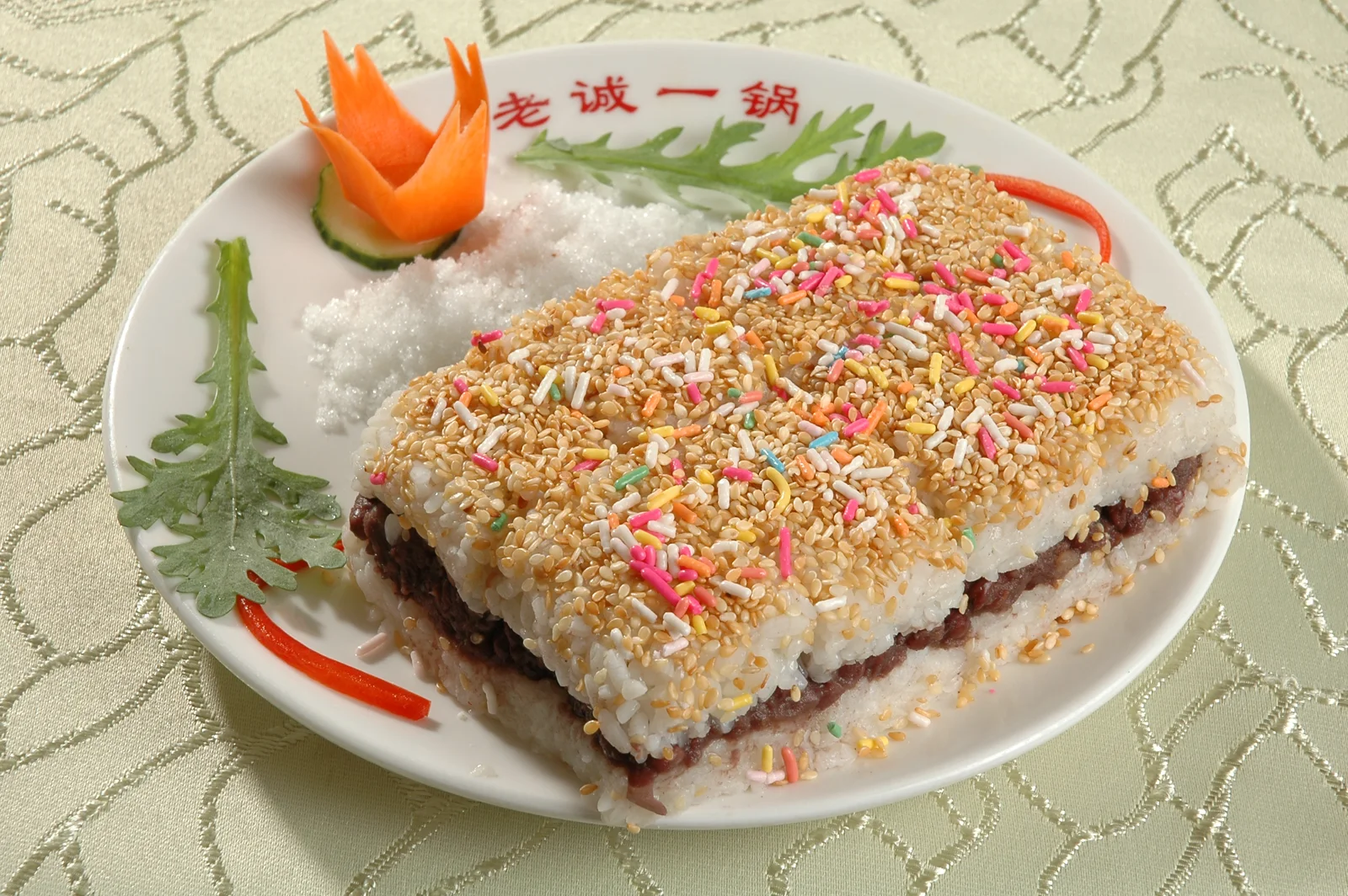 Layered glutinous rice cake with red-bean filling and sesame