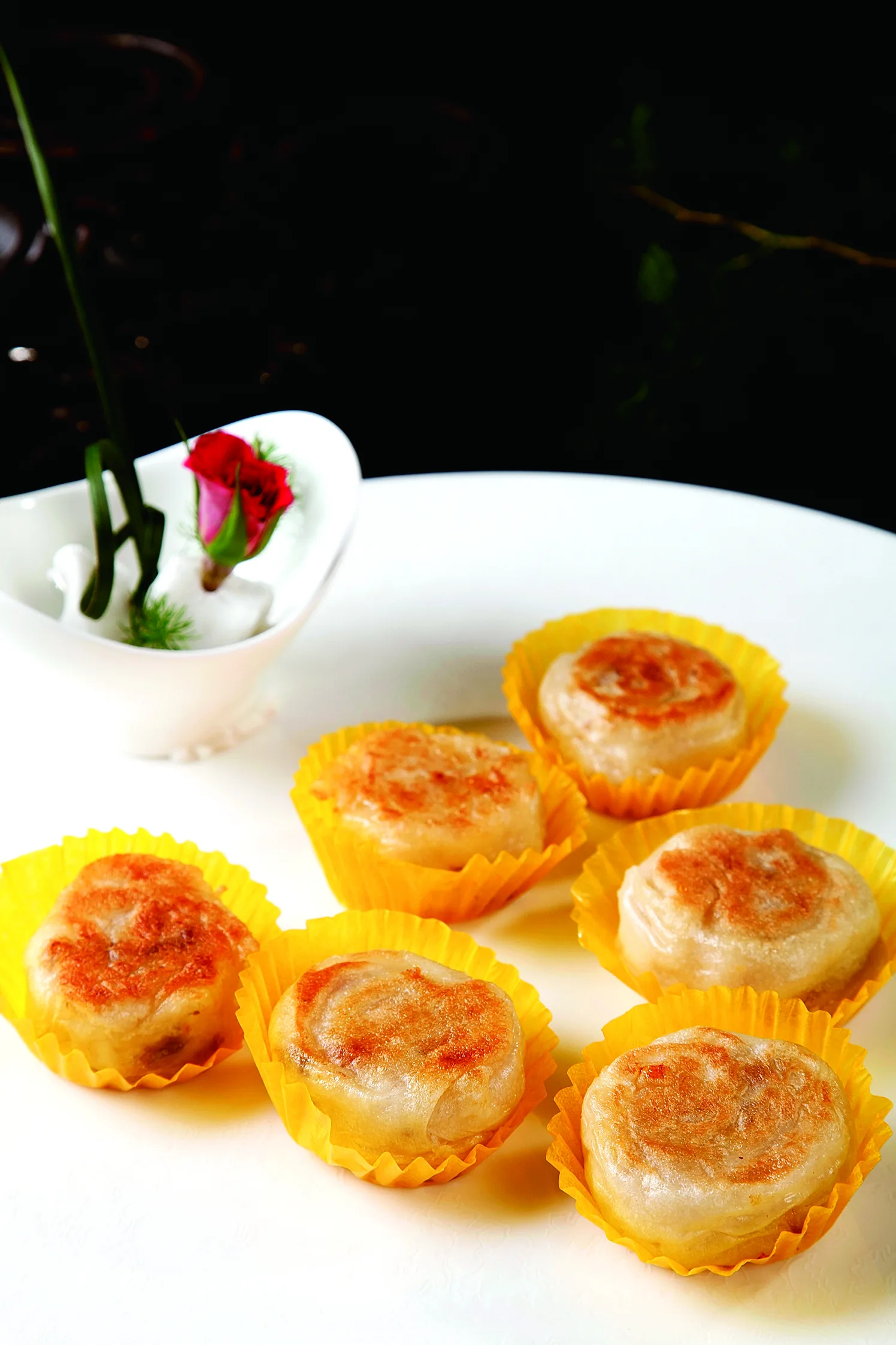 A tall flaky radish pastry illustrating a savory duck-oil-style Nanjing pastry