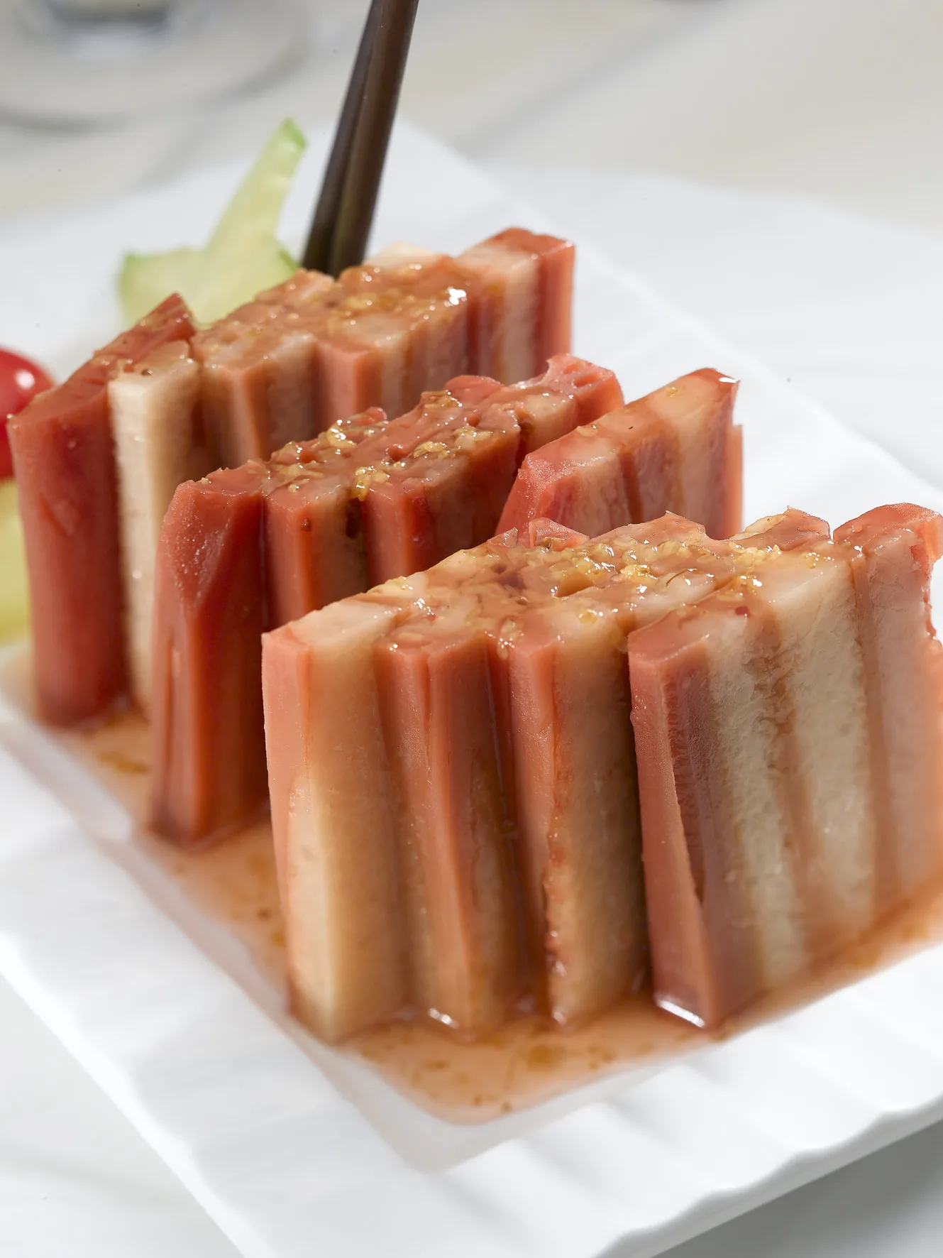 Sliced lotus root filled with glutinous rice and finished with osmanthus syrup