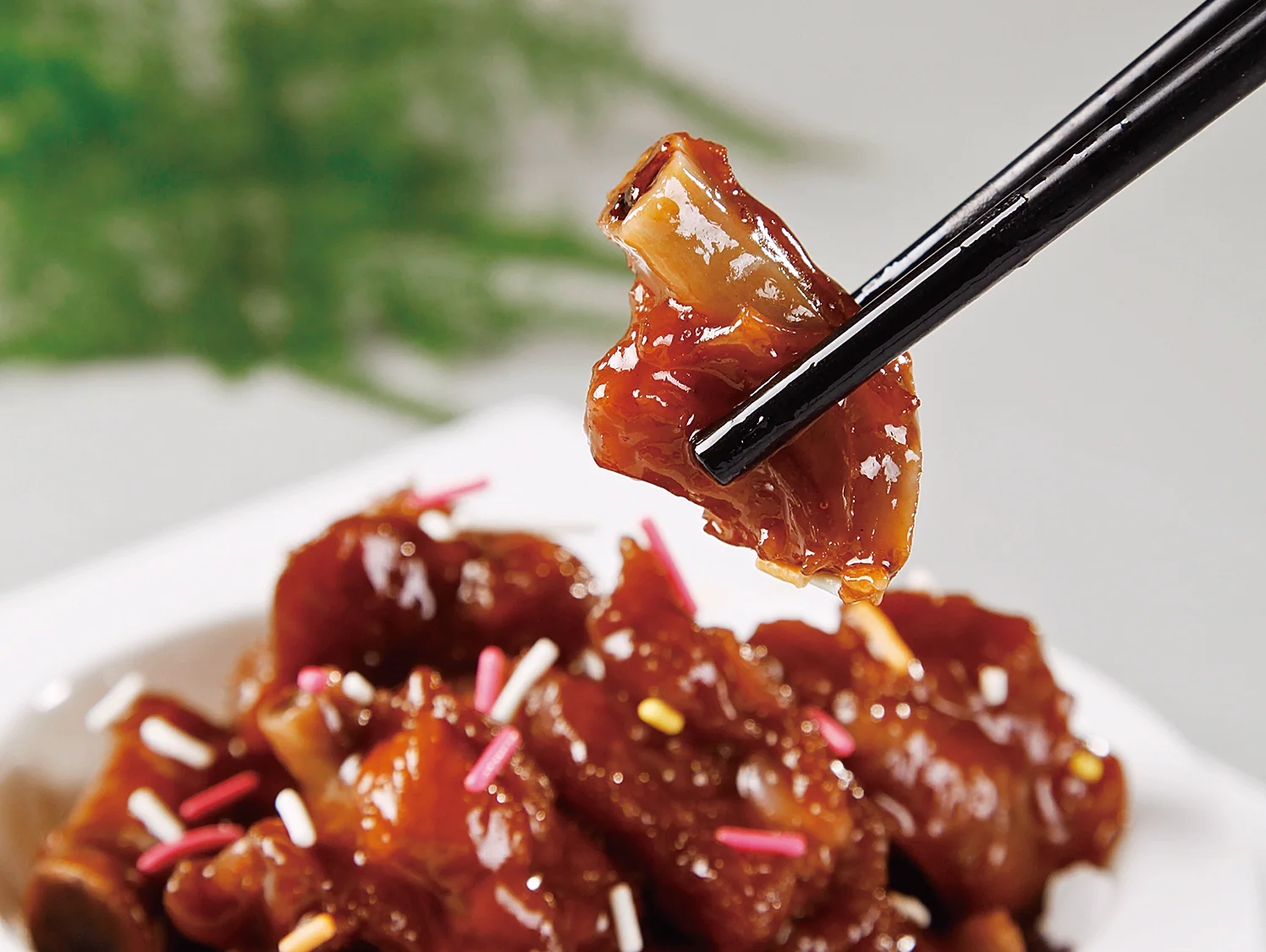 Suzhou-style sweet-sour ribs showing lacquered sauce and the bite-size texture expected at a shared table