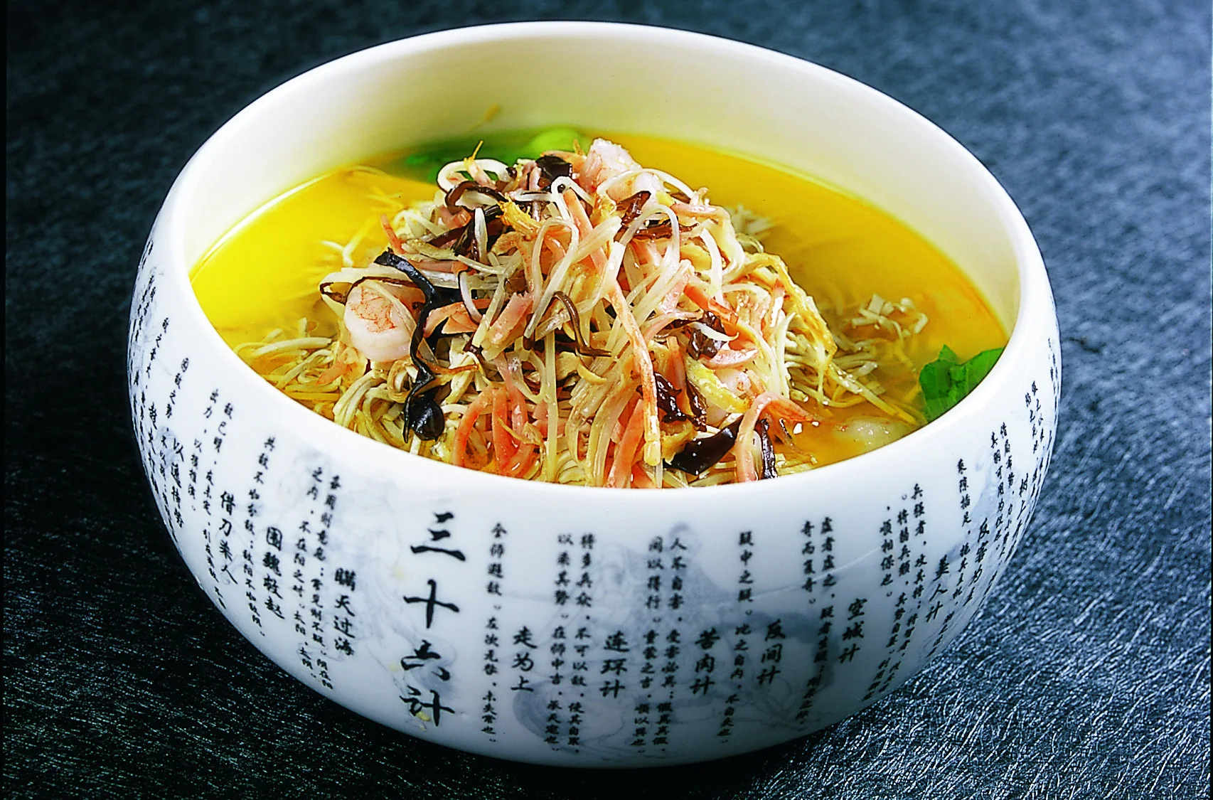 Yangzhou boiled shredded tofu with fine strands held apart by stock and restrained toppings