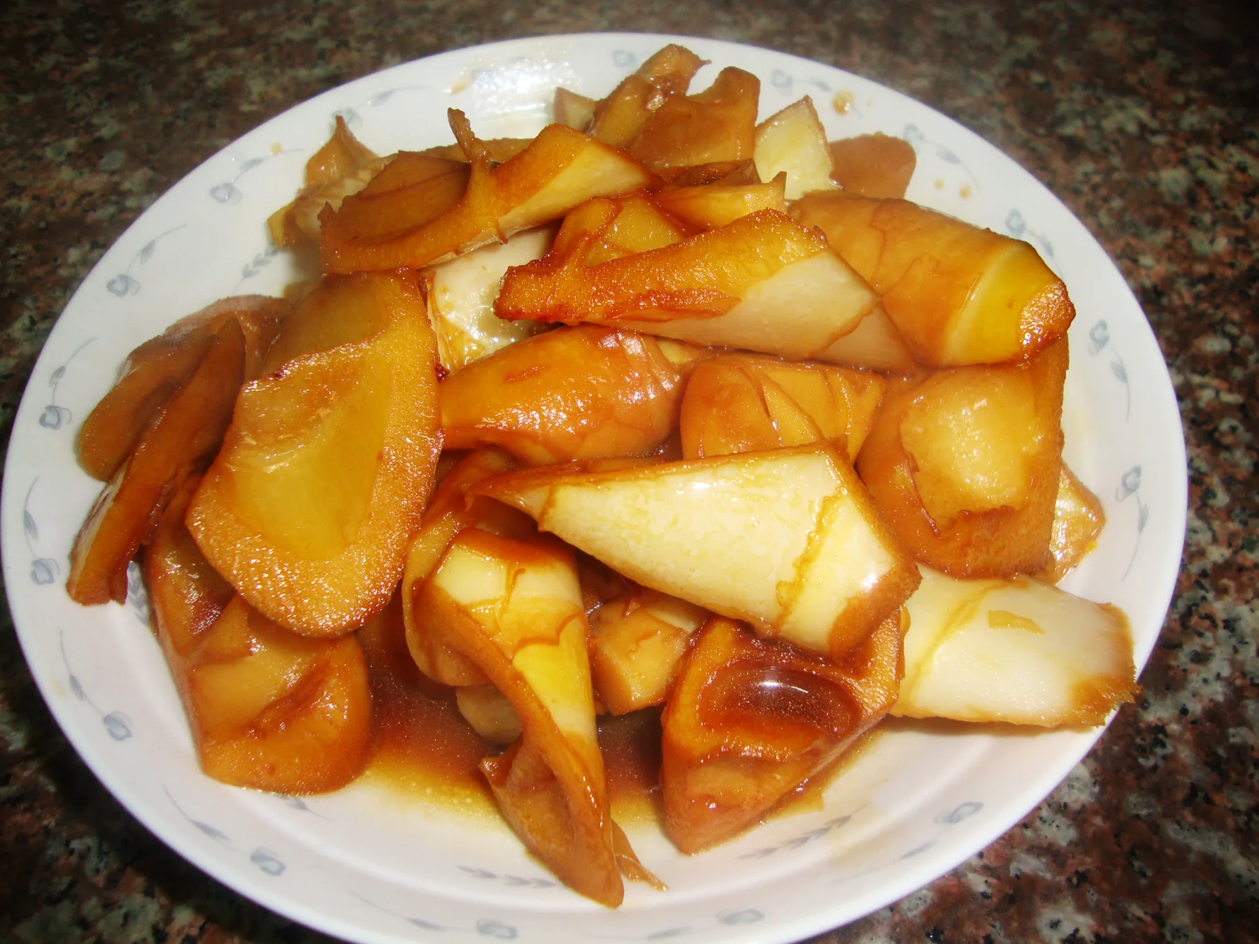 Braised spring bamboo shoots coated lightly with soy-rich cooking juices