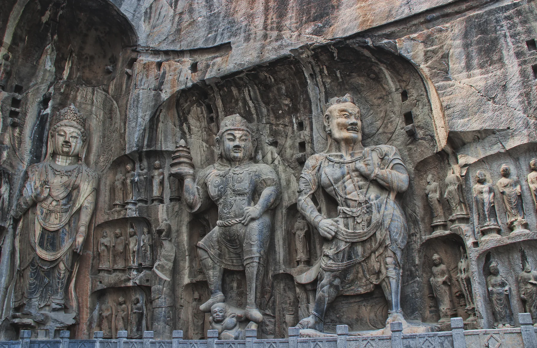 Buddhist figures carved into the rock at the Longmen Grottoes near Luoyang