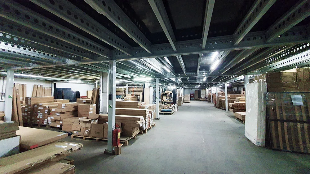 Rows of flat-pack furniture cartons stored on warehouse racking