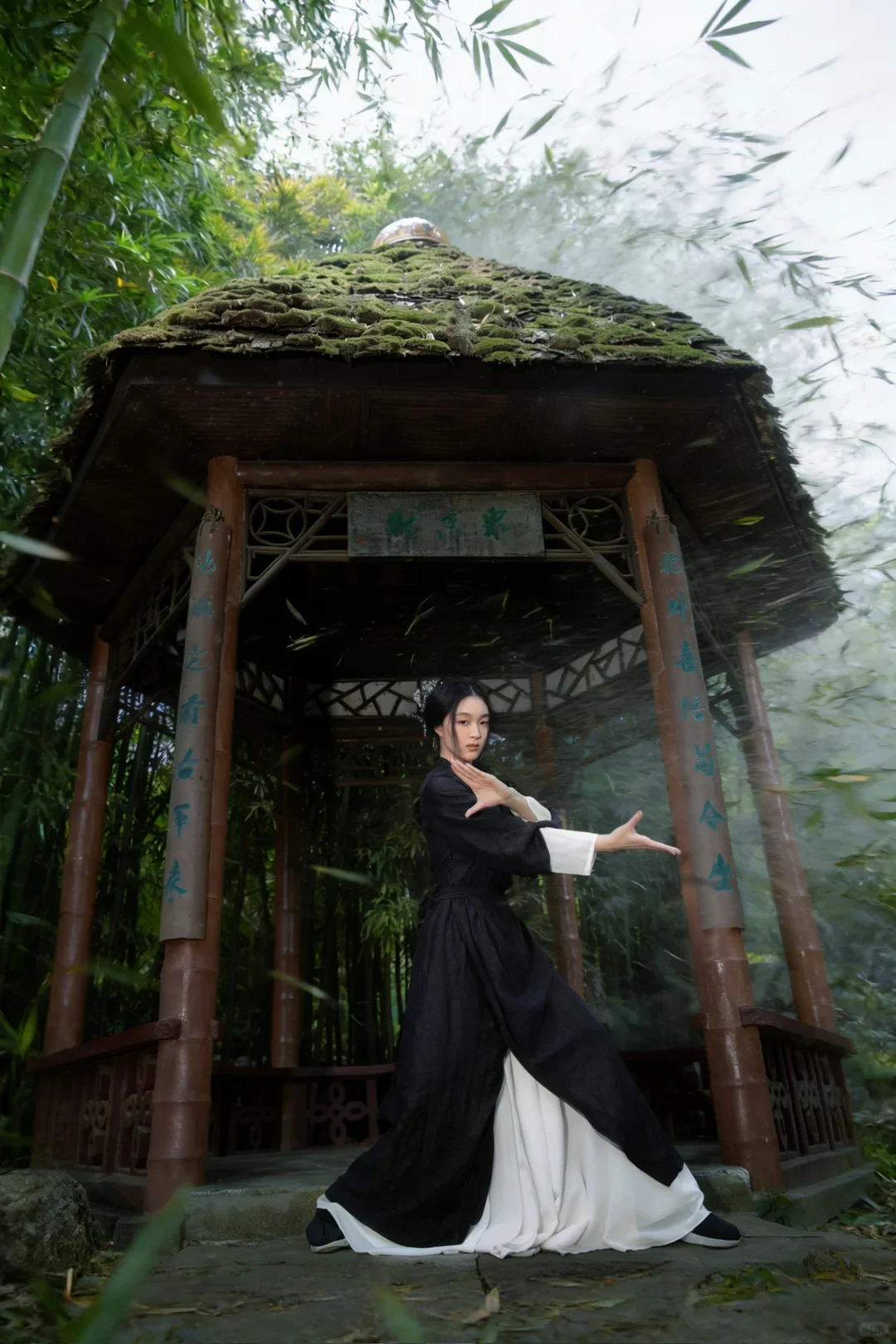 Wuxia meaning visualized by a real costumed performer posing in a bamboo pavilion