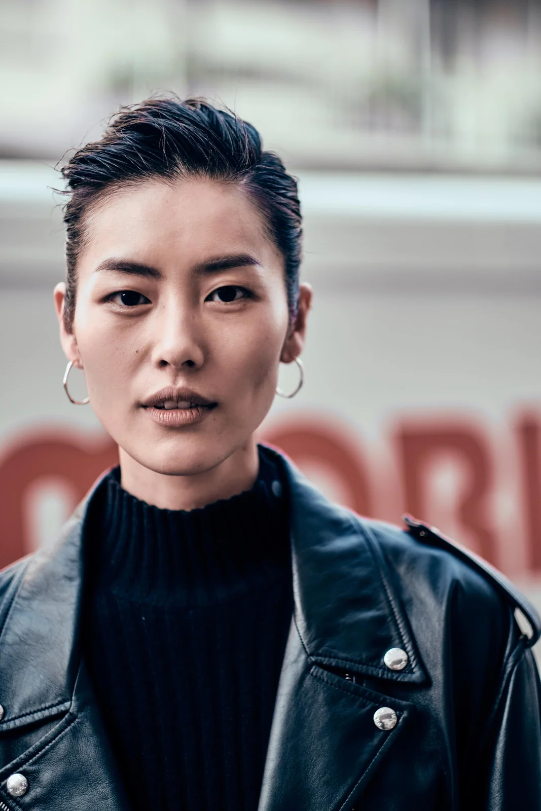 Liu Wen photographed in a dark coat during Milan Fashion Week in 2019