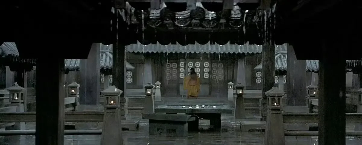 Nameless remains a small figure across the rain-dark palace court in Hero 2002
