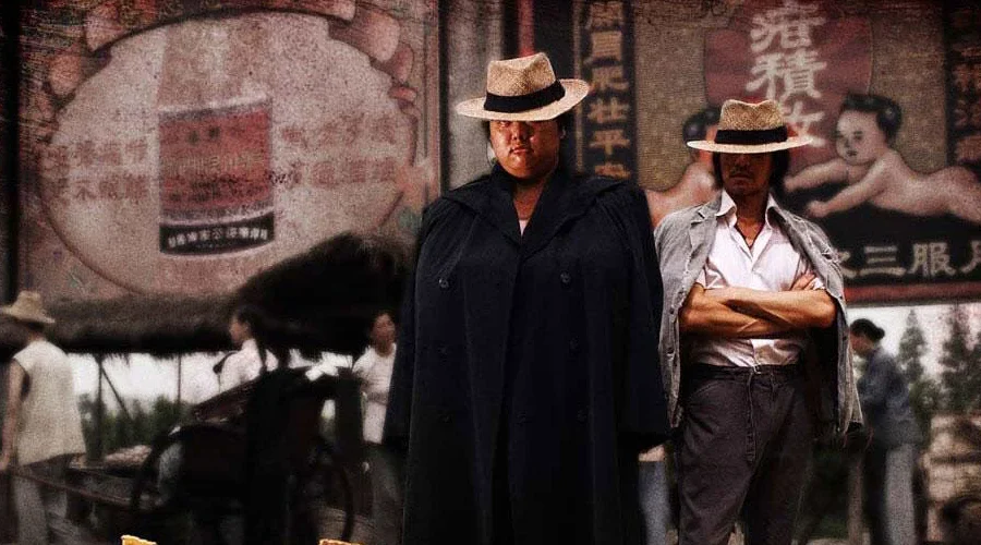 Two Axe Gang figures pose in period Shanghai while the street continues behind them