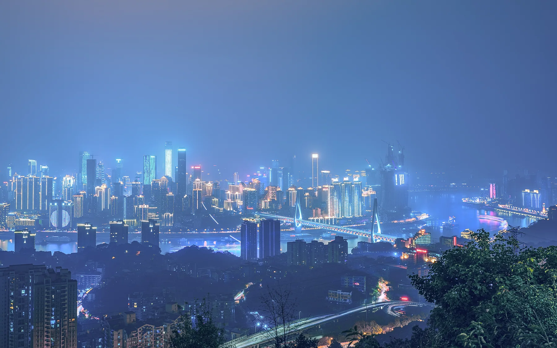 Chongqing's night topography introducing the elevation, pressure and urban scale translated by its rap scene