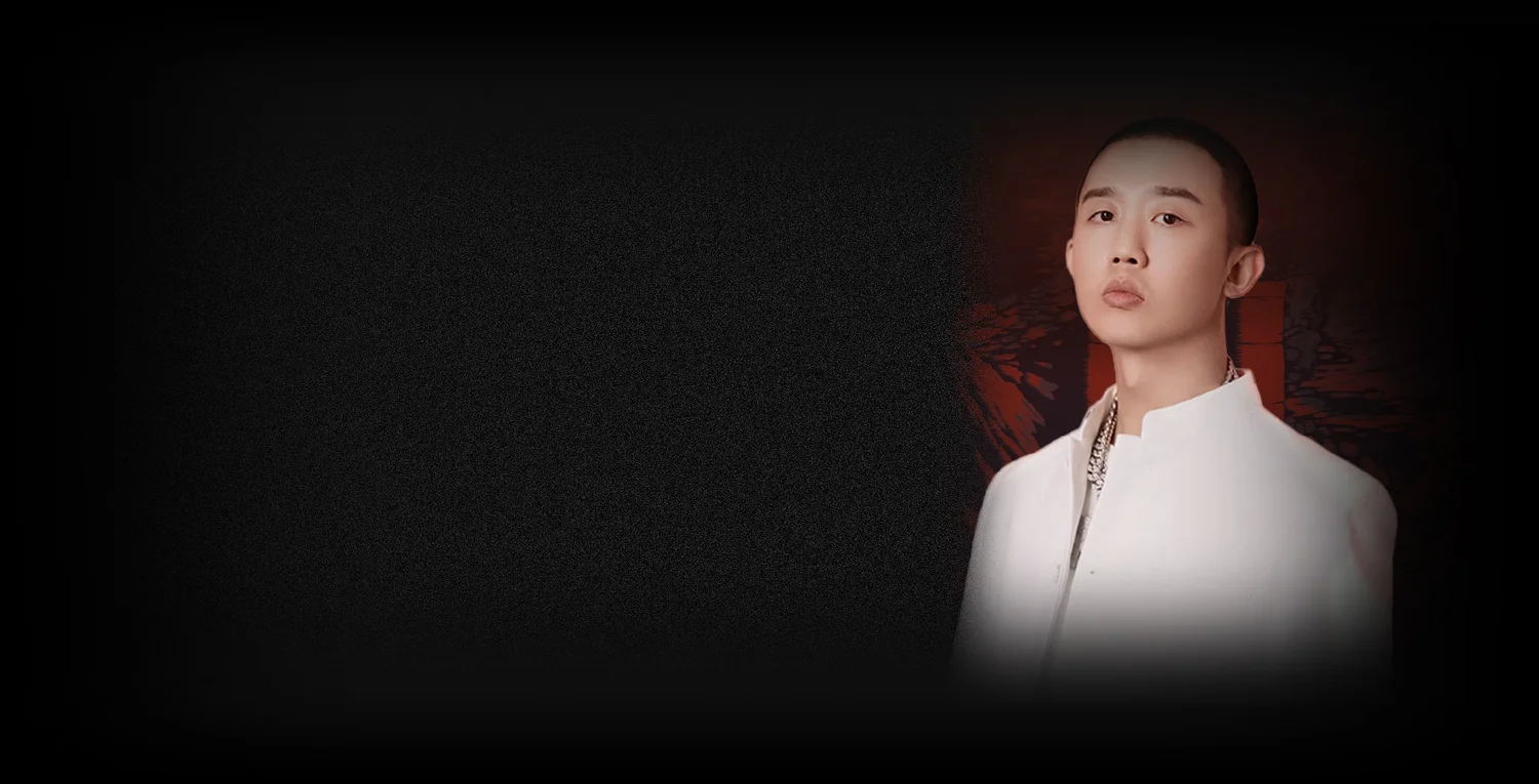 GAI Zhou Yan in a white official artist portrait against a dark background