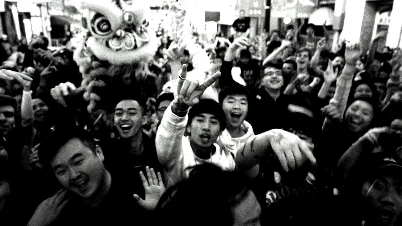 Higher Brothers trading verses in the official Open It Up video