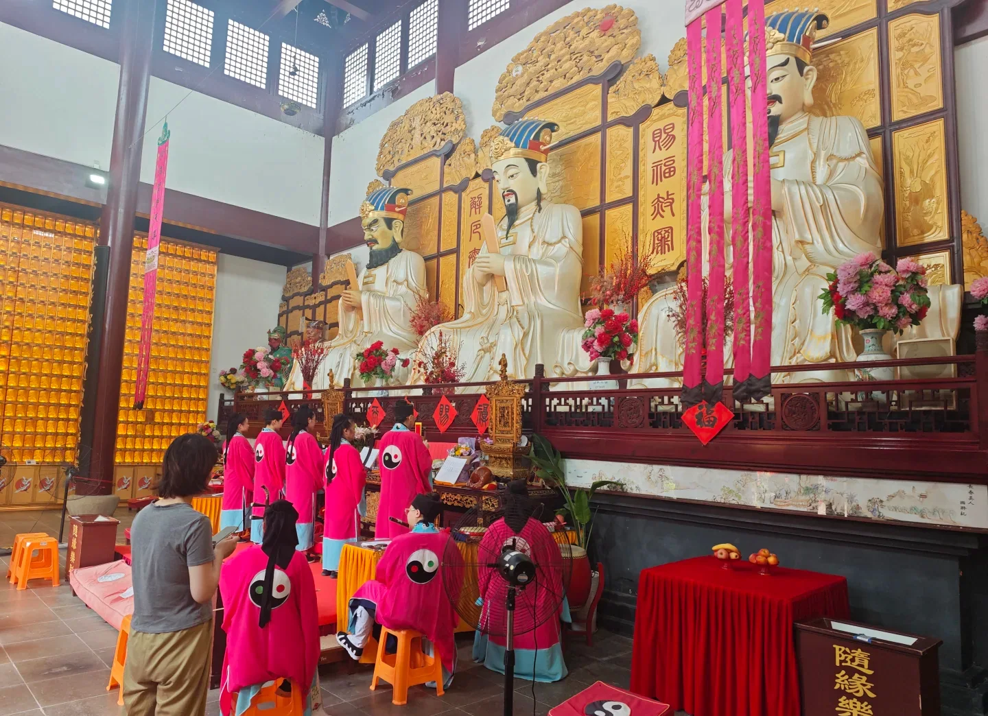 Women Daoist practitioners conducting a liturgical service inside Sanyuan Palace in Shanghai