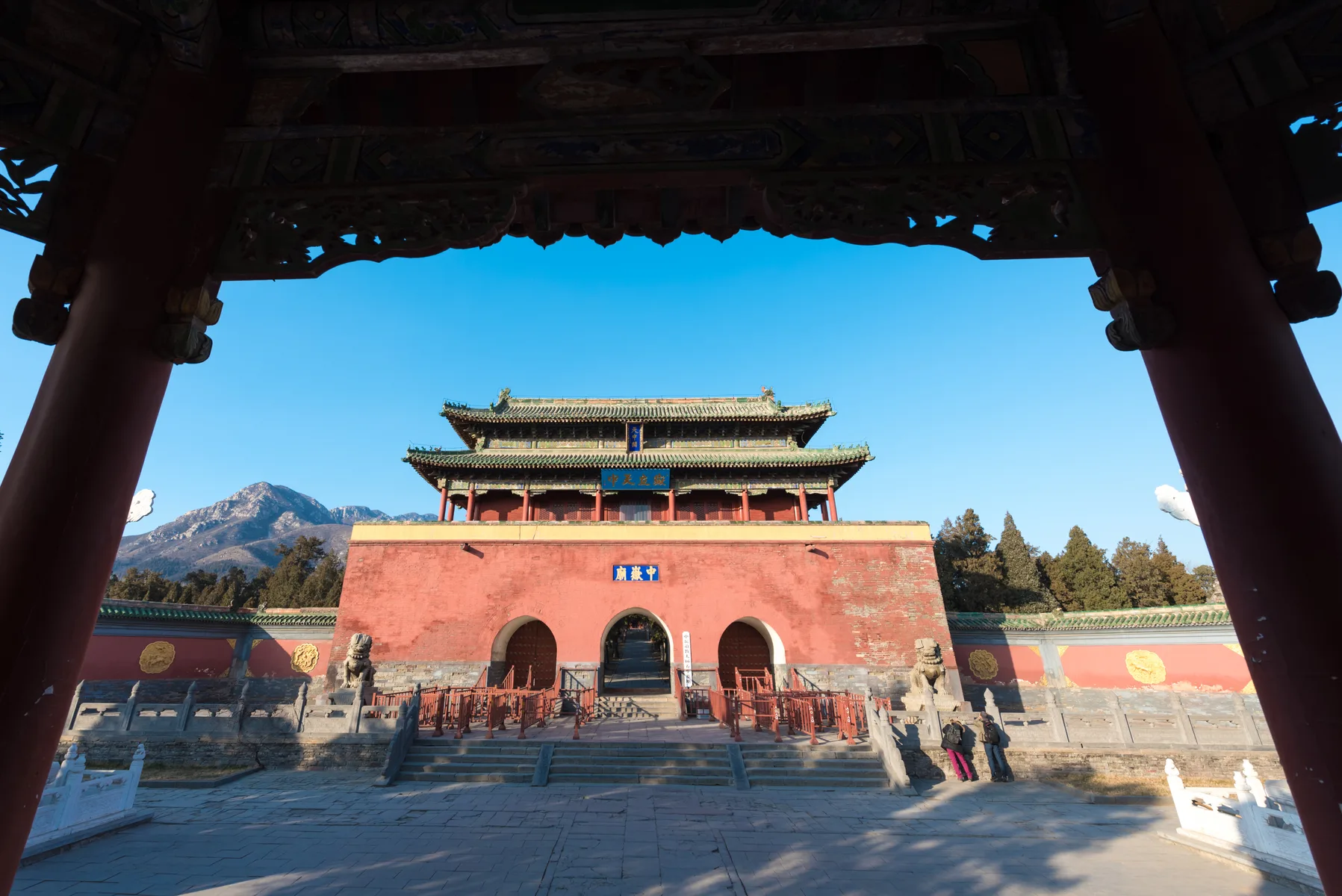 The Zhongyue Temple gate in Henan is framed through an older timber arch