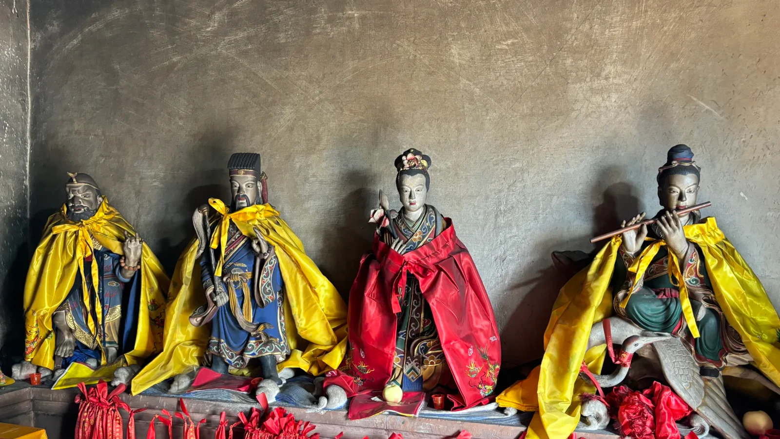 Four named members of the Eight Immortals group installed inside Qiyun Mountain's Eight Immortals Cave