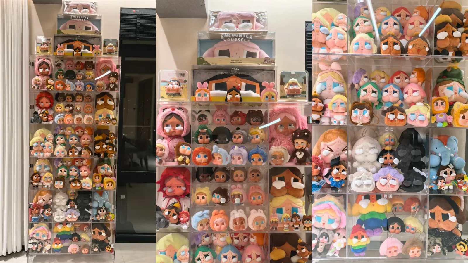 Three authorized views of one CRYBABY collection filling a tall acrylic cabinet from floor level to boxed pieces above