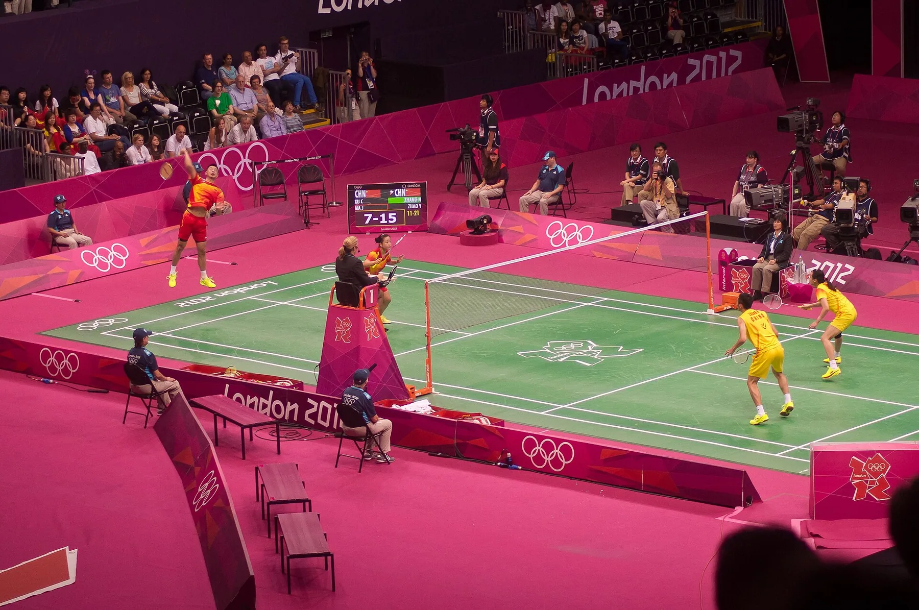 Two Chinese mixed-doubles pairs compete across the net in the 2012 Olympic final