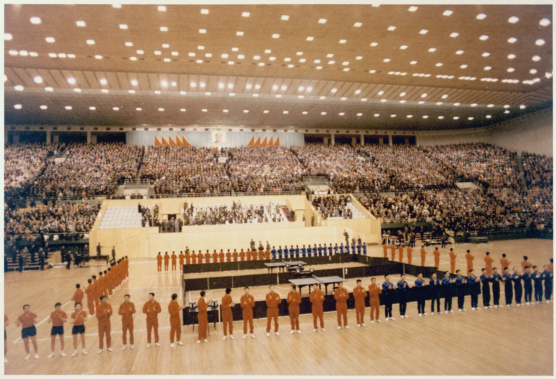 Chinese and American athletes line a table-tennis arena during a 1972 athletic exhibition in Beijing