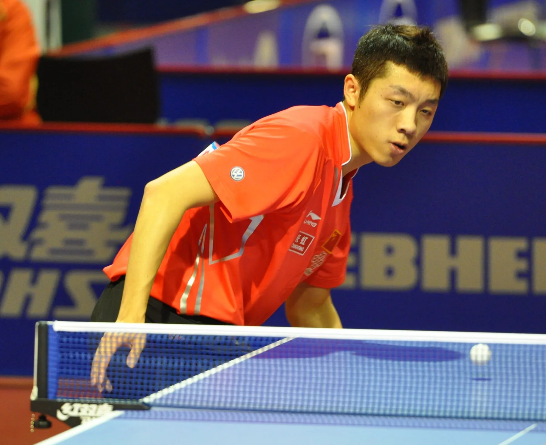 Xu Xin crouches close to the table while preparing to receive at the 2011 World Championships