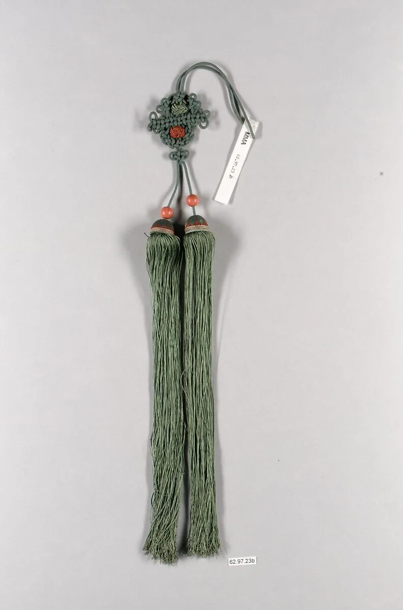 Qing silk ornament with a suspension loop, compact knotted body, beads and two long tassels