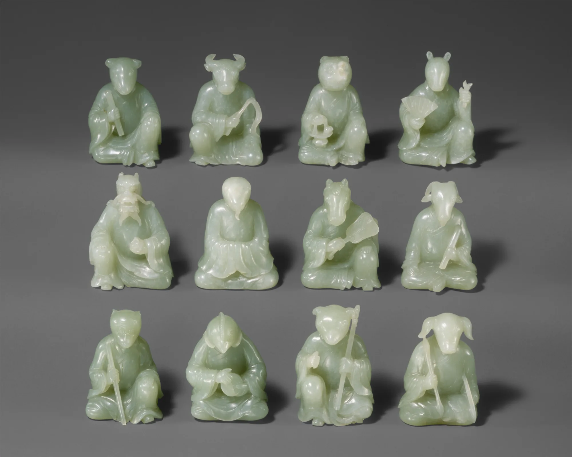Chinese zodiac calculator hero showing a complete set of twelve Qing-dynasty jade animal figures