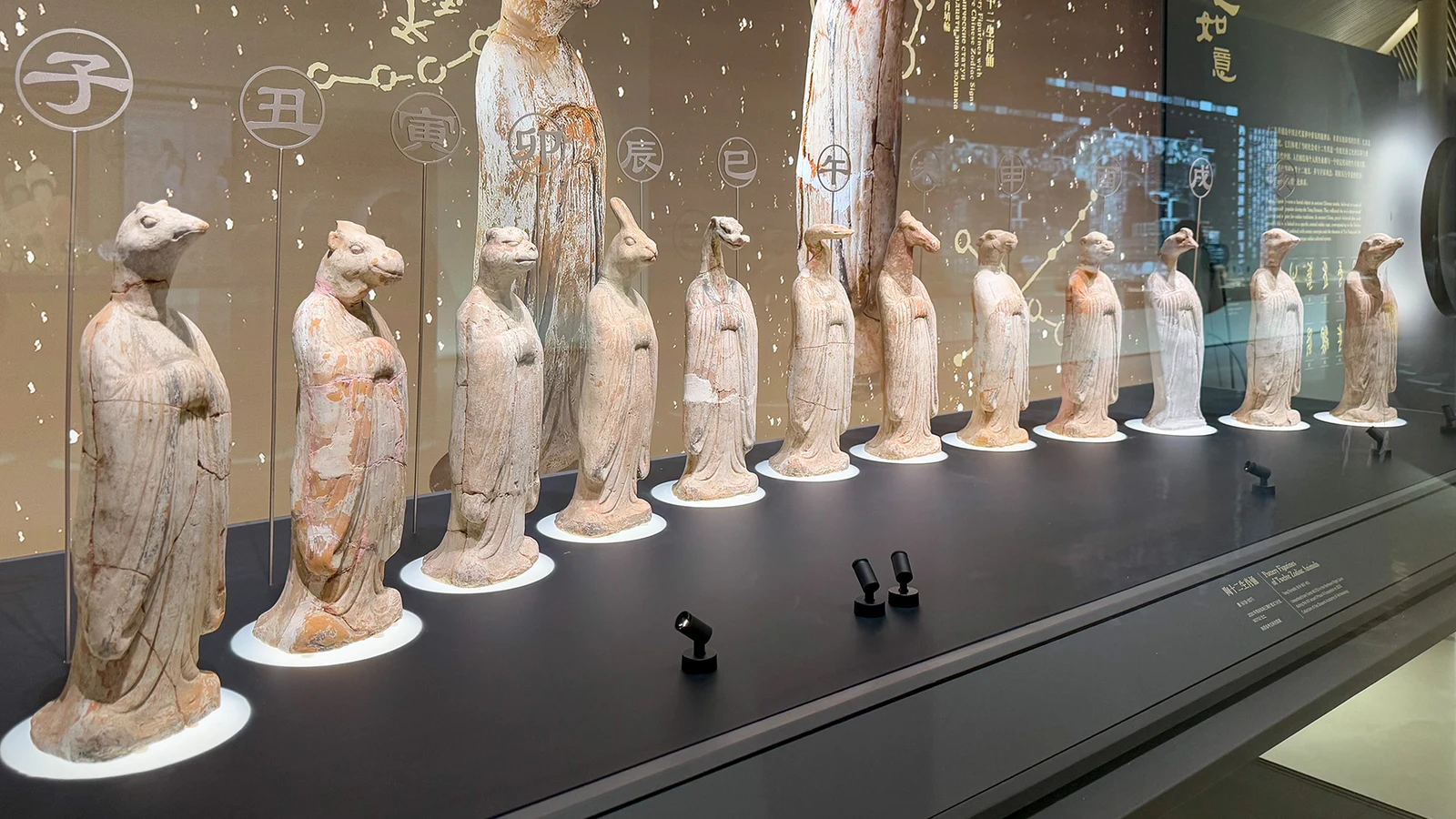 Twelve animal-headed Tang-style pottery figures showing the Chinese zodiac years cycle