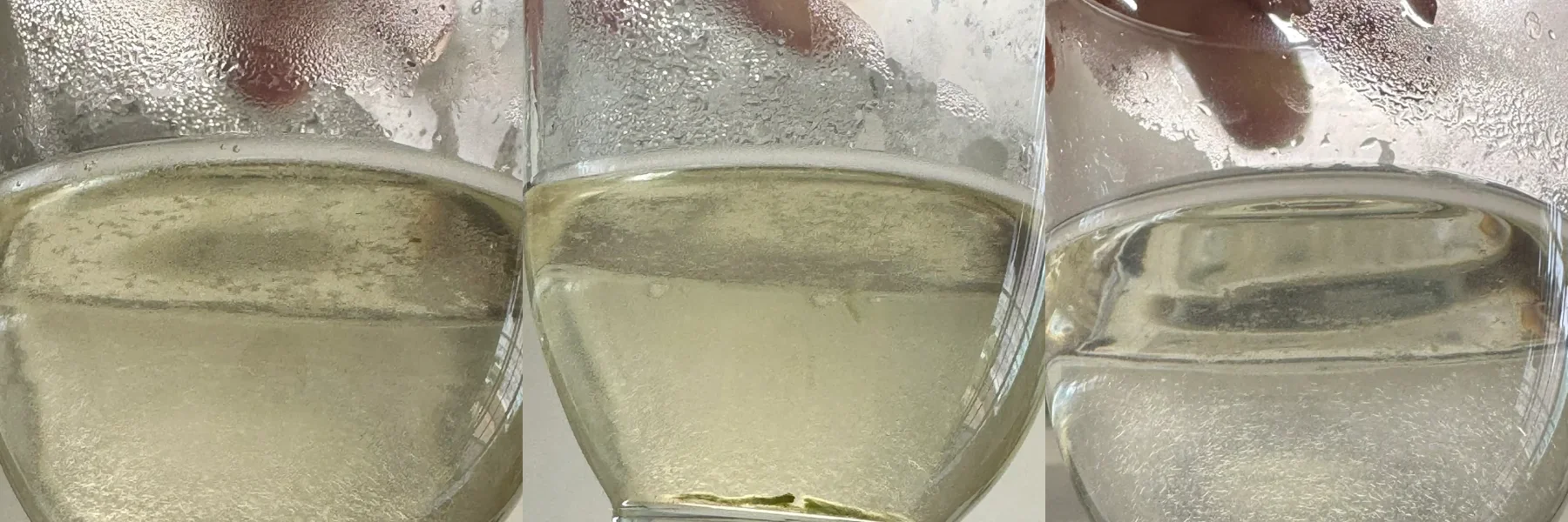 Three retail Biluochun liquors photographed in one consumer comparison; color differences are visible but do not prove freshness, grade or origin