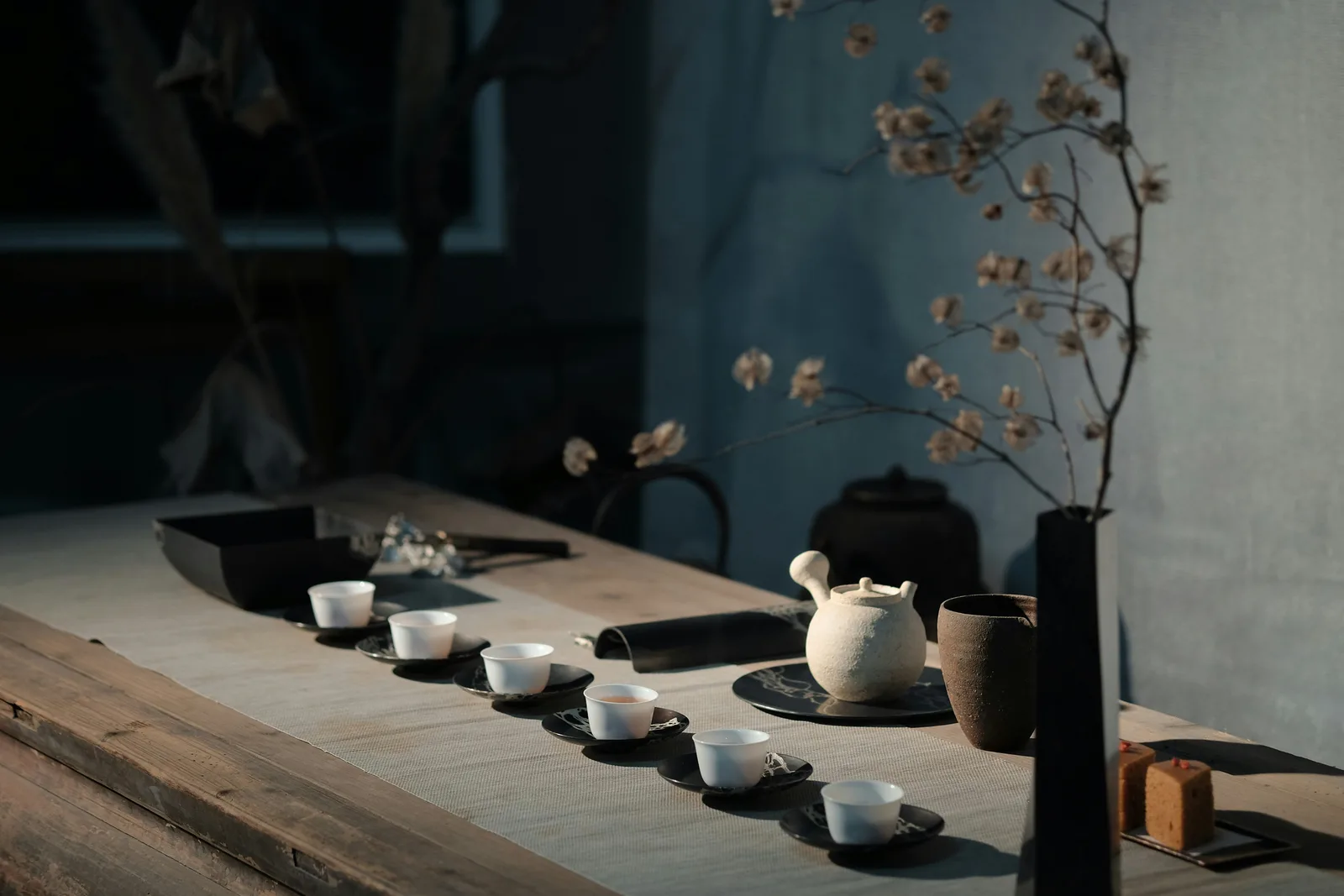 A real tea table with a pot and six cups showing Chinese tea practice as shared service
