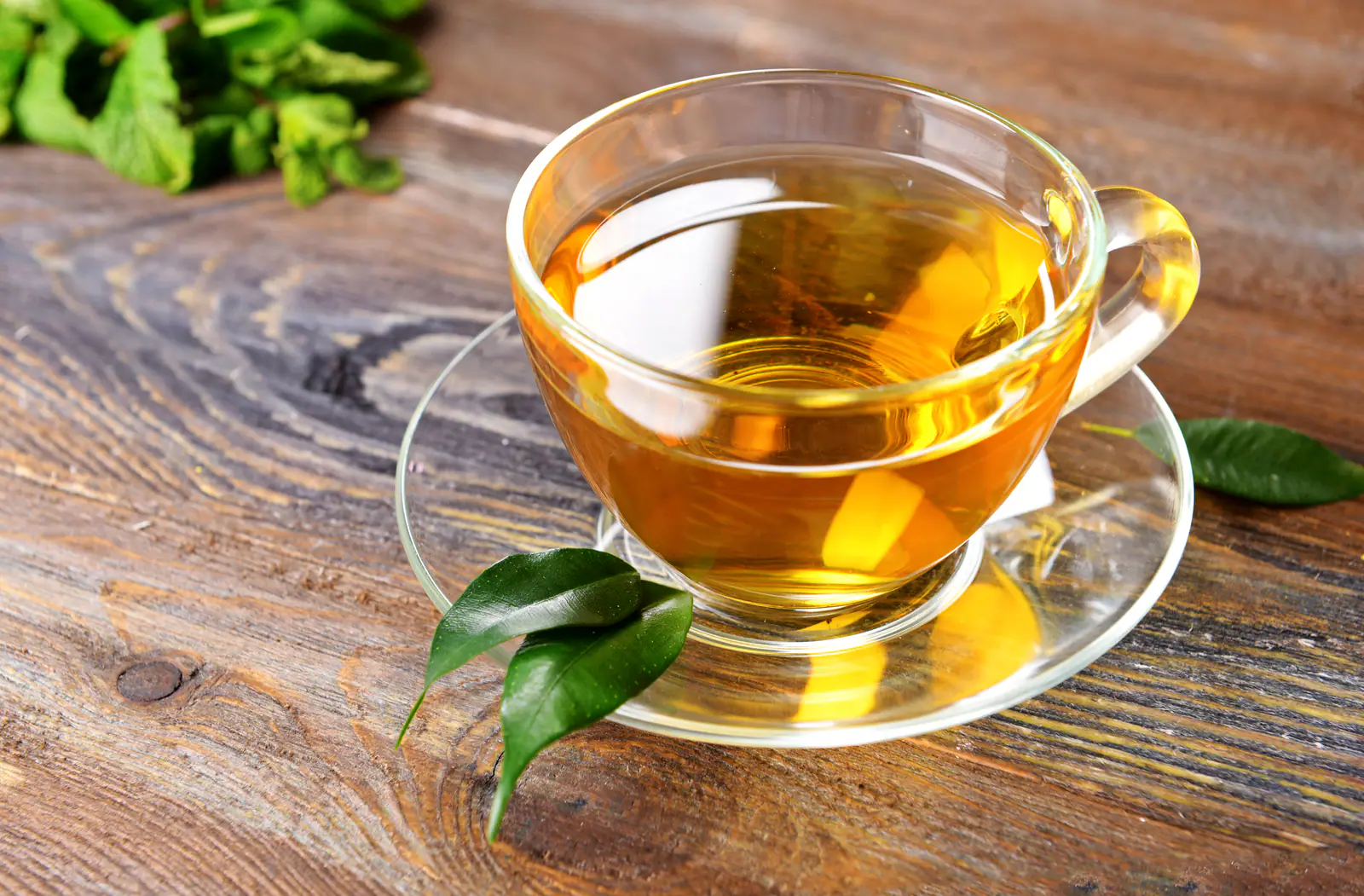 Golden amber tea liquor in a clear glass cup