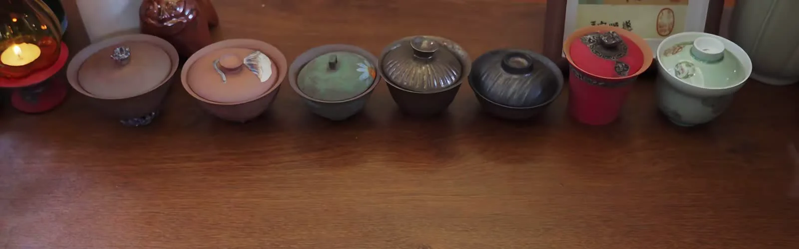 A lineup of gaiwan forms used to compare capacity, rim, lid and handling before decoration
