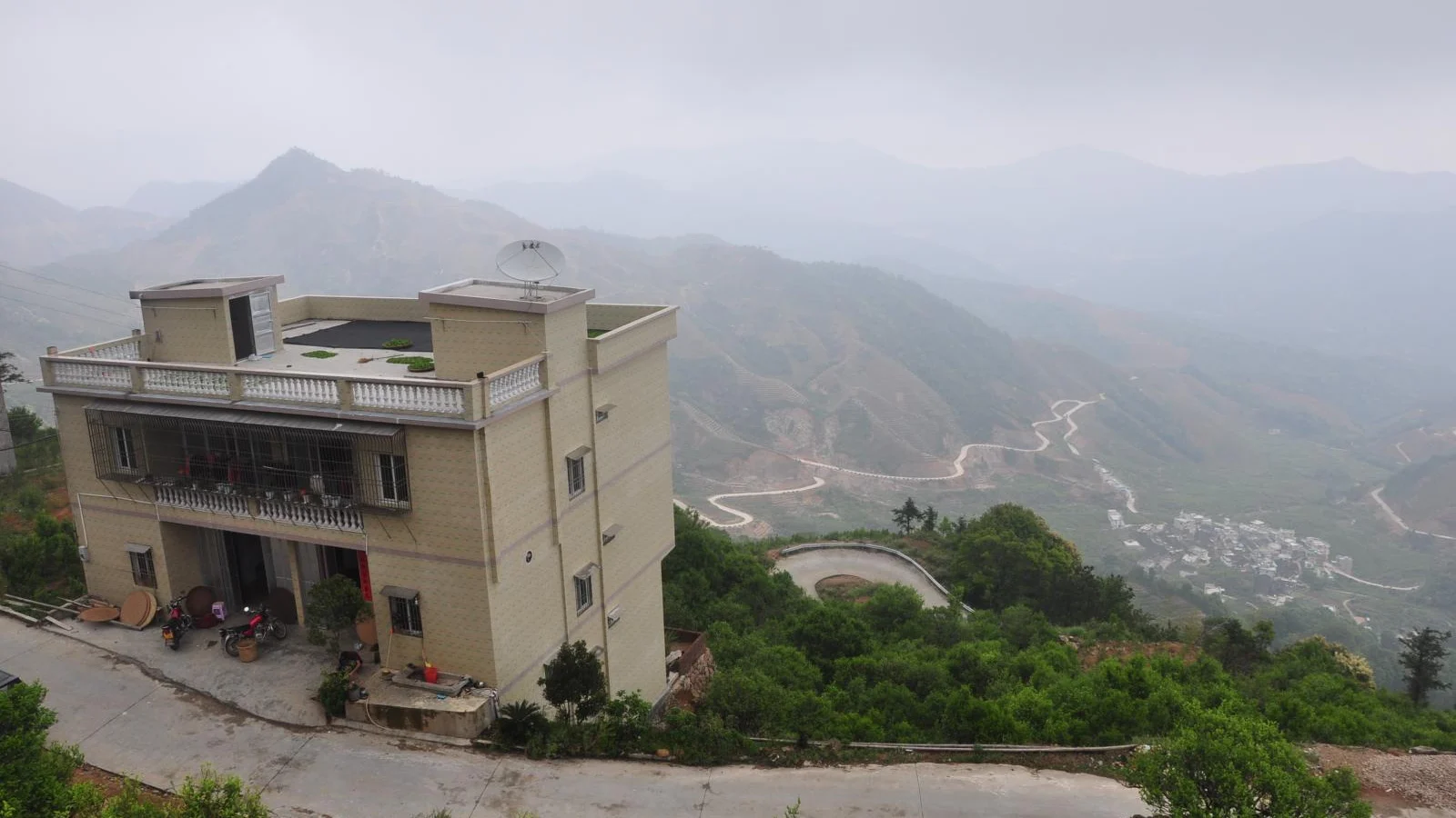 A documented view across Phoenix Mountain in Chao'an showing steep inhabited terrain and distant ridges