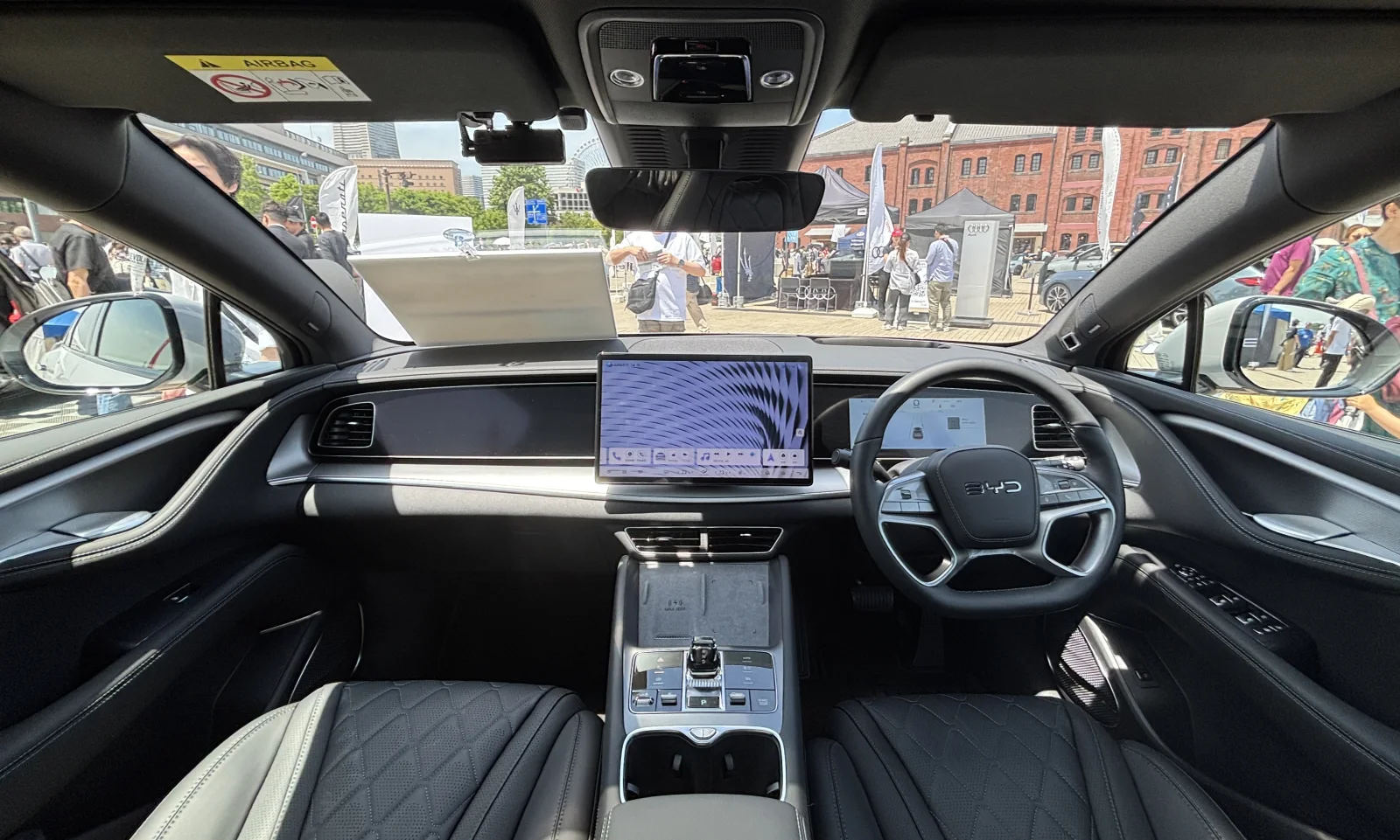 BYD Sealion 7 interior photographed in Japan in 2025, showing a real foreign-market BYD cabin but not US ownership support