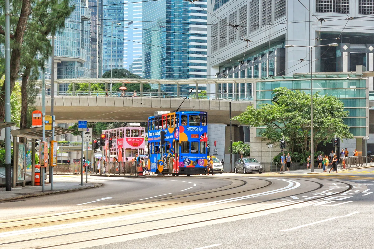 Trams and contemporary towers in Central Hong Kong during travel to China