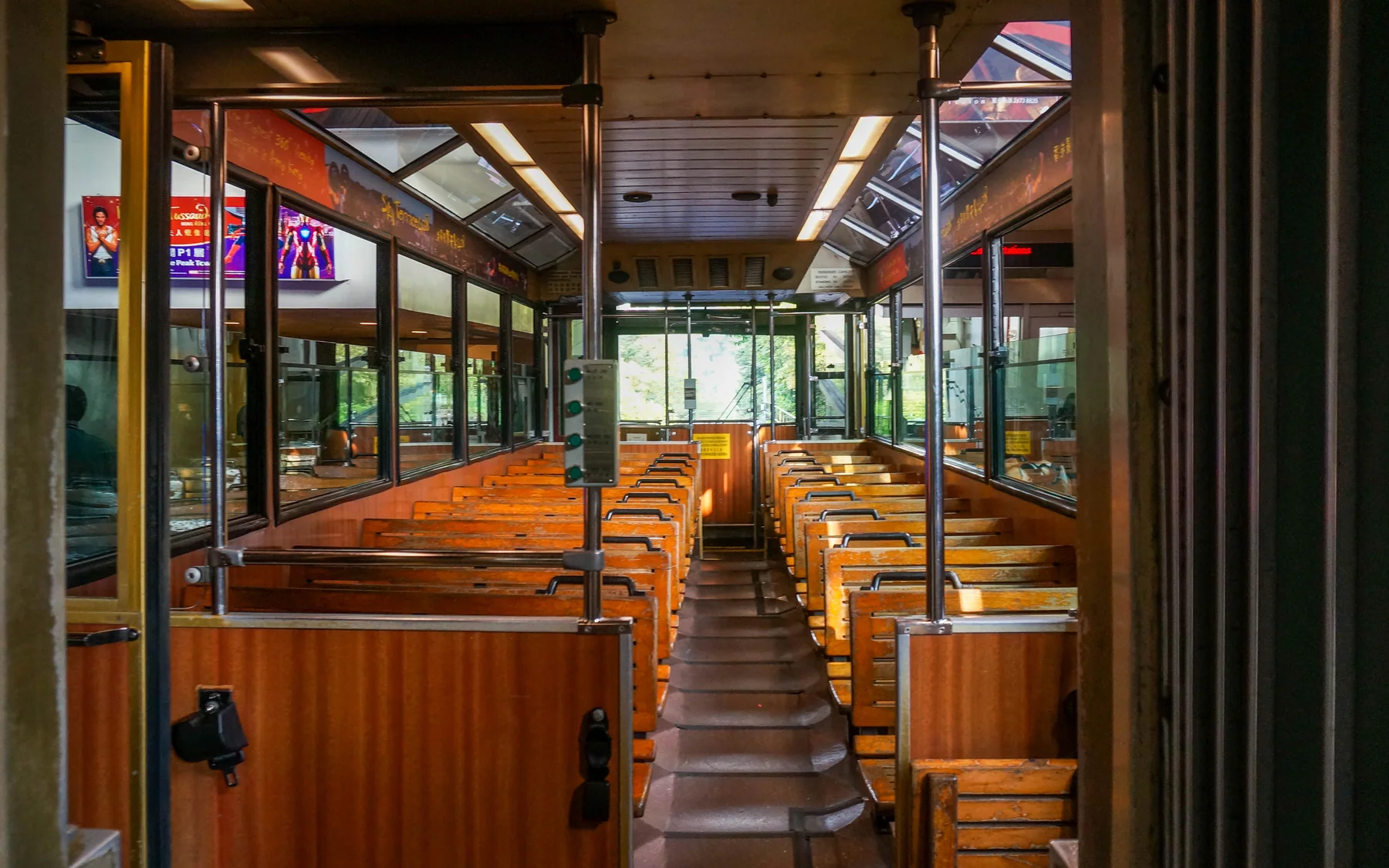 A Hong Kong tram interior showing compact public movement as part of the city's daily rhythm