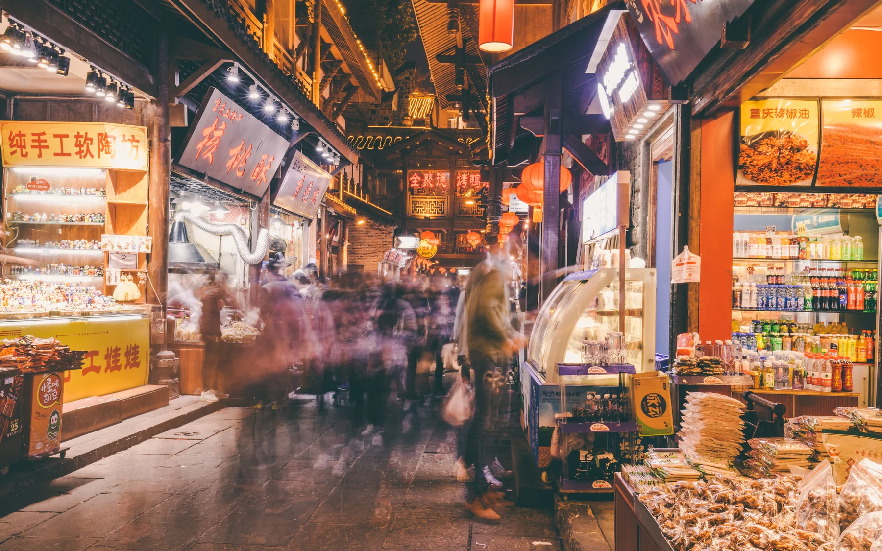 A Chongqing evening food street used as a practical stop rather than a generic nightlife image