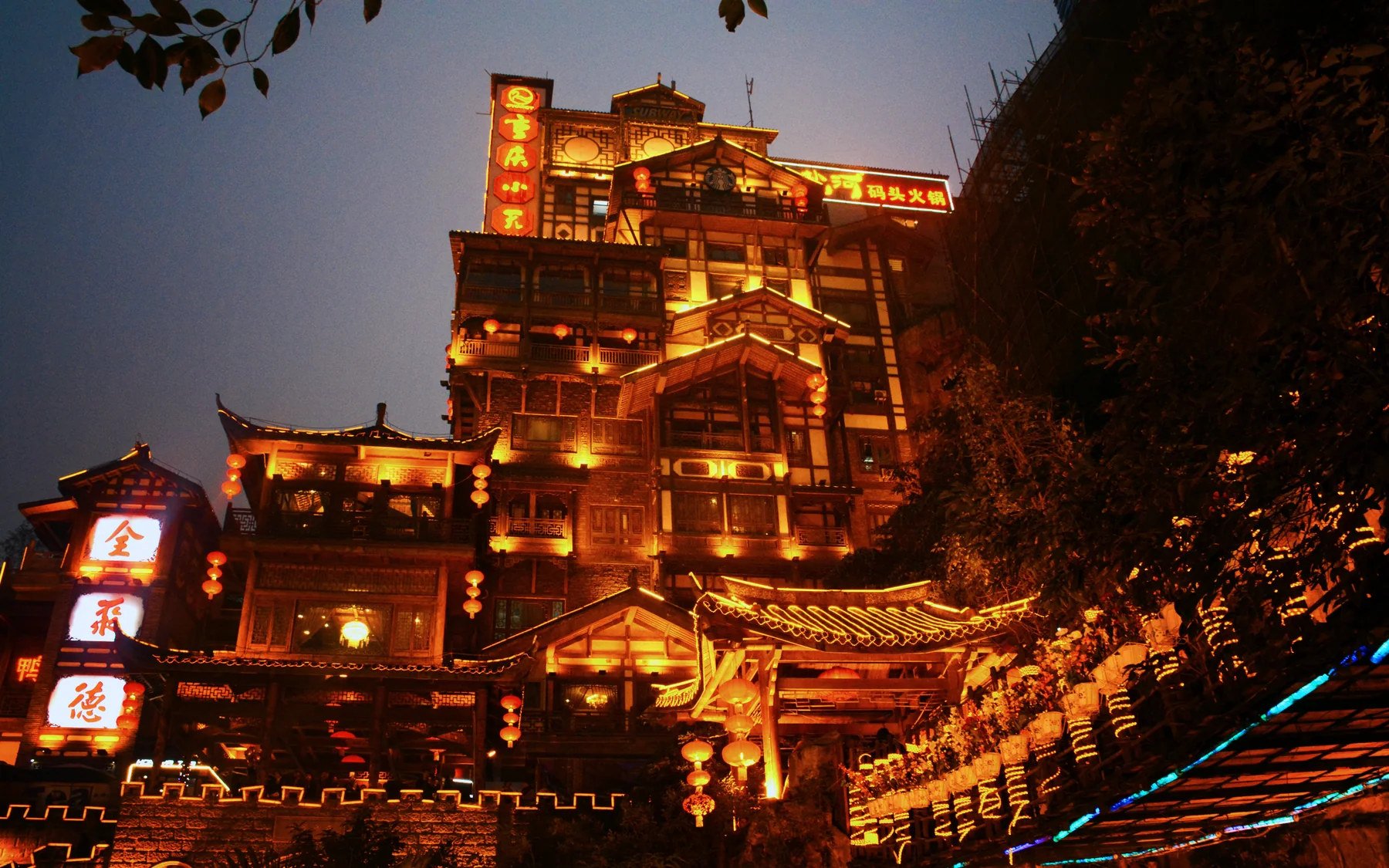 Hongyadong at night showing the illuminated destination travelers must approach from the correct level