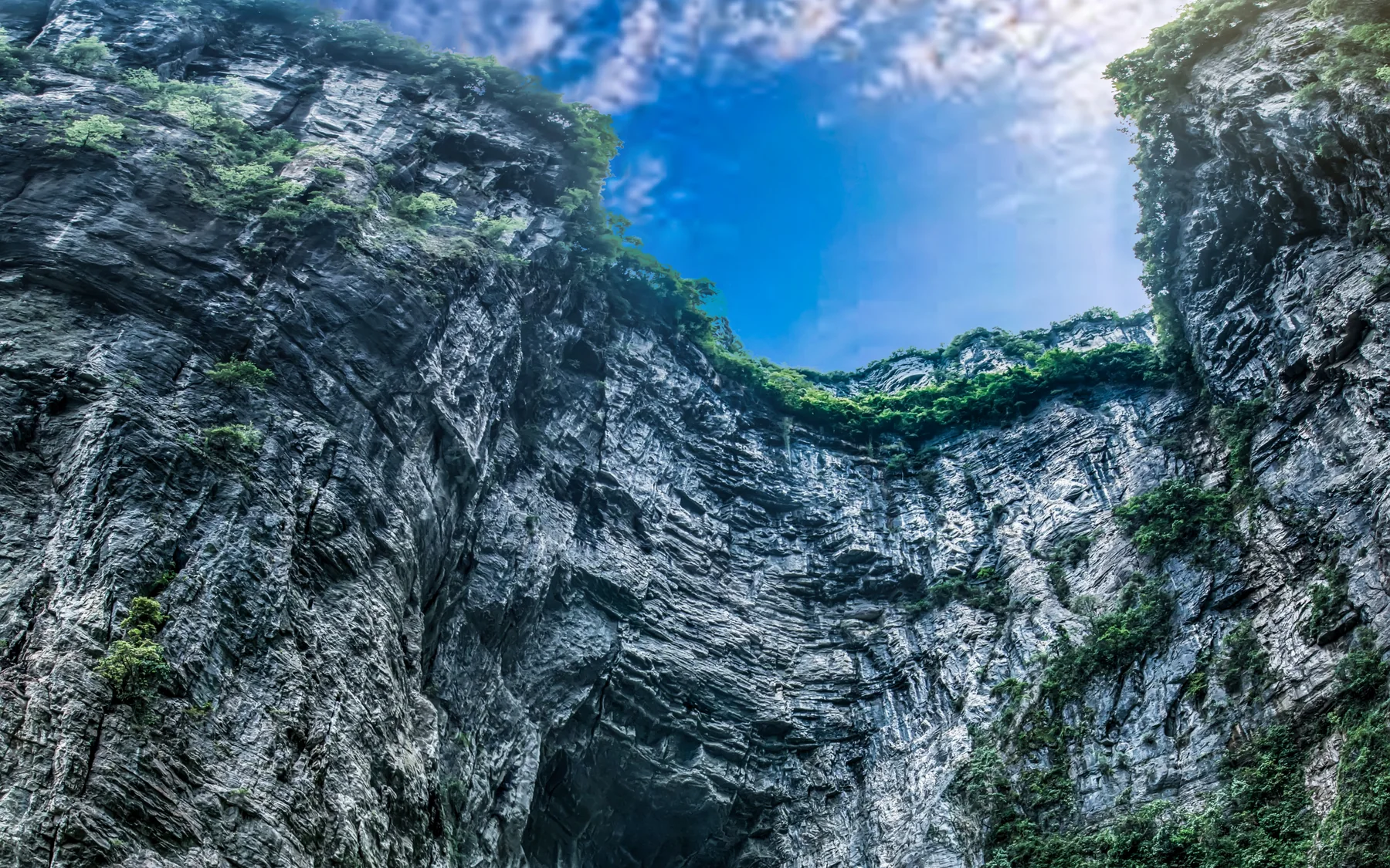 A Wulong karst opening showing the terrain behind a separate Chongqing day trip