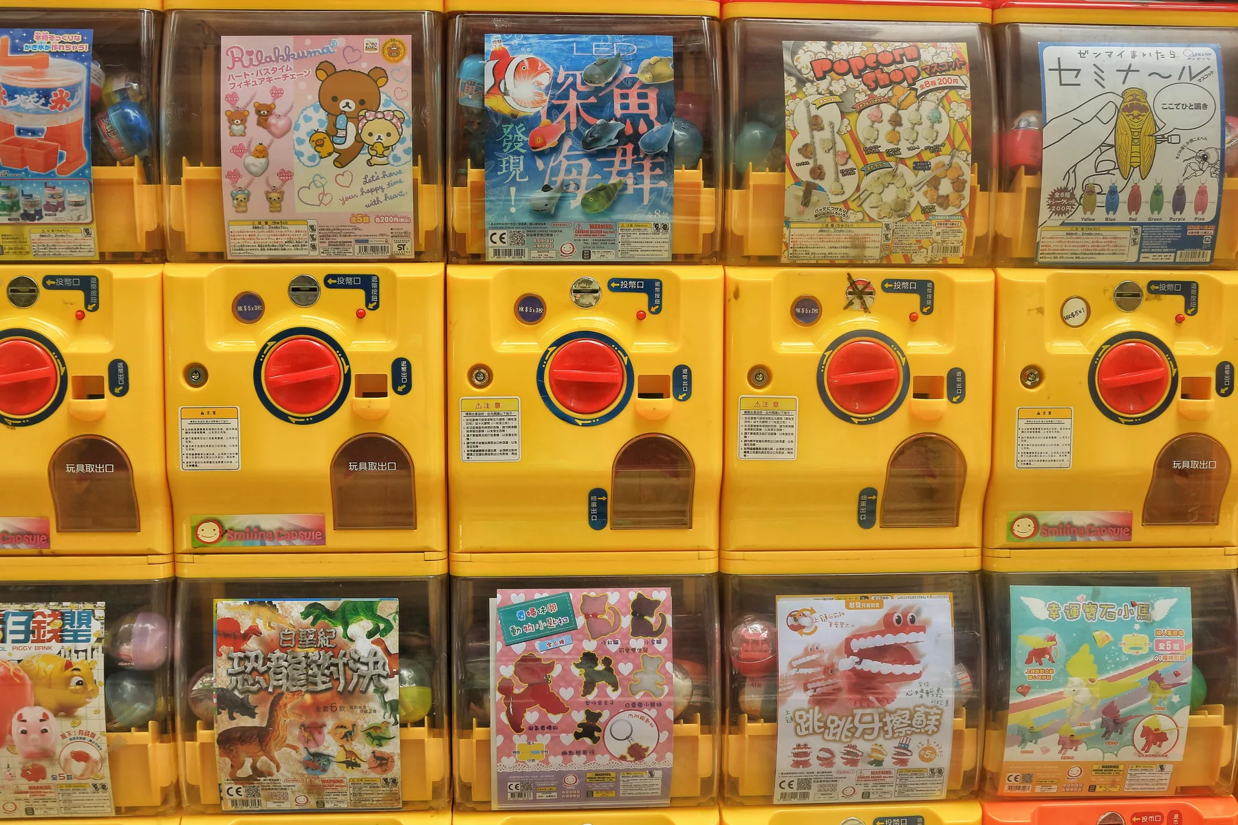A wall of capsule-toy machines occupying a compact Hong Kong retail frontage