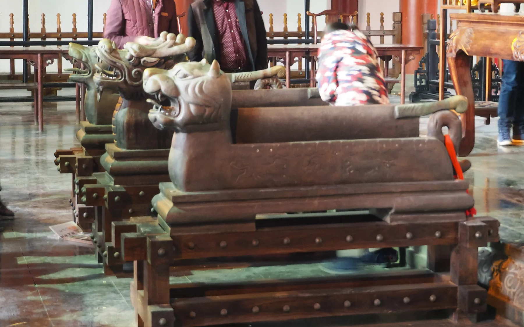 The three ceremonial blades inside Kaifeng Fu showing how Bao Zheng memory is staged for visitors